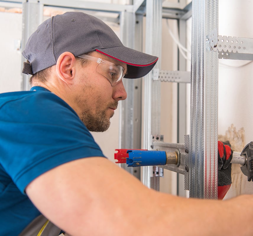 NES Plumbing technician working on a residential plumbing installation near Metamora, MI
