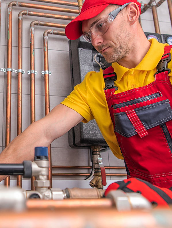 NES Plumbing technician working on a residential plumbing installation near Oxford, MI