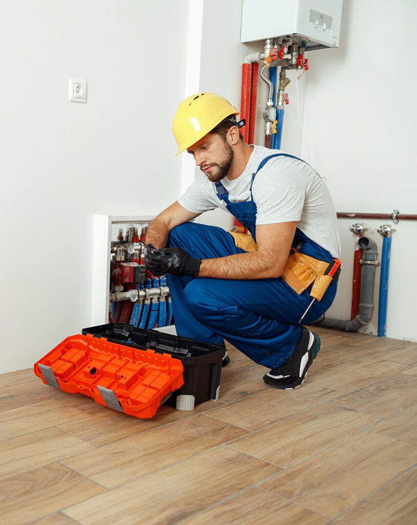 NES Plumbing technician working on a residential plumbing installation near Goodrich, MI