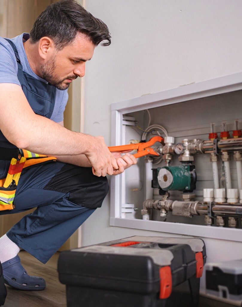 NES Plumbing technician working on a residential plumbing installation near Romeo, MI