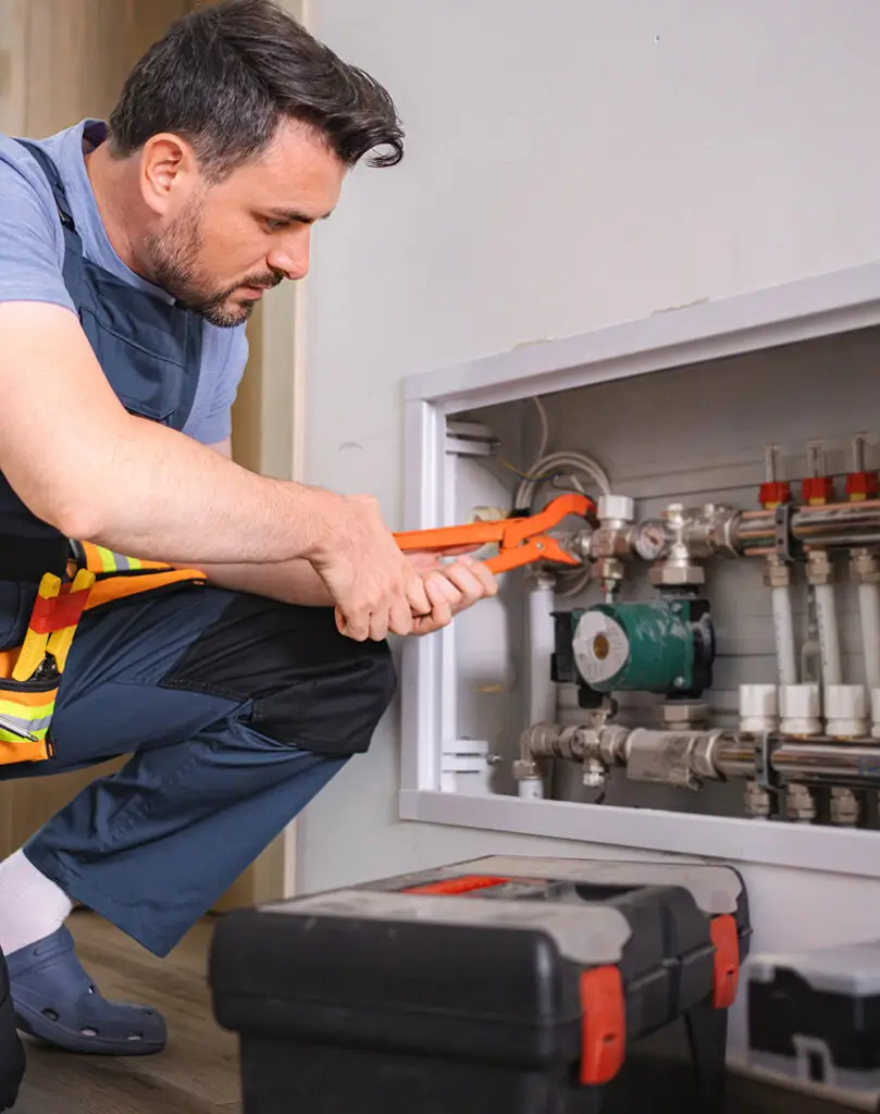 NES Plumbing technician working on a residential plumbing installation near Romeo, MI